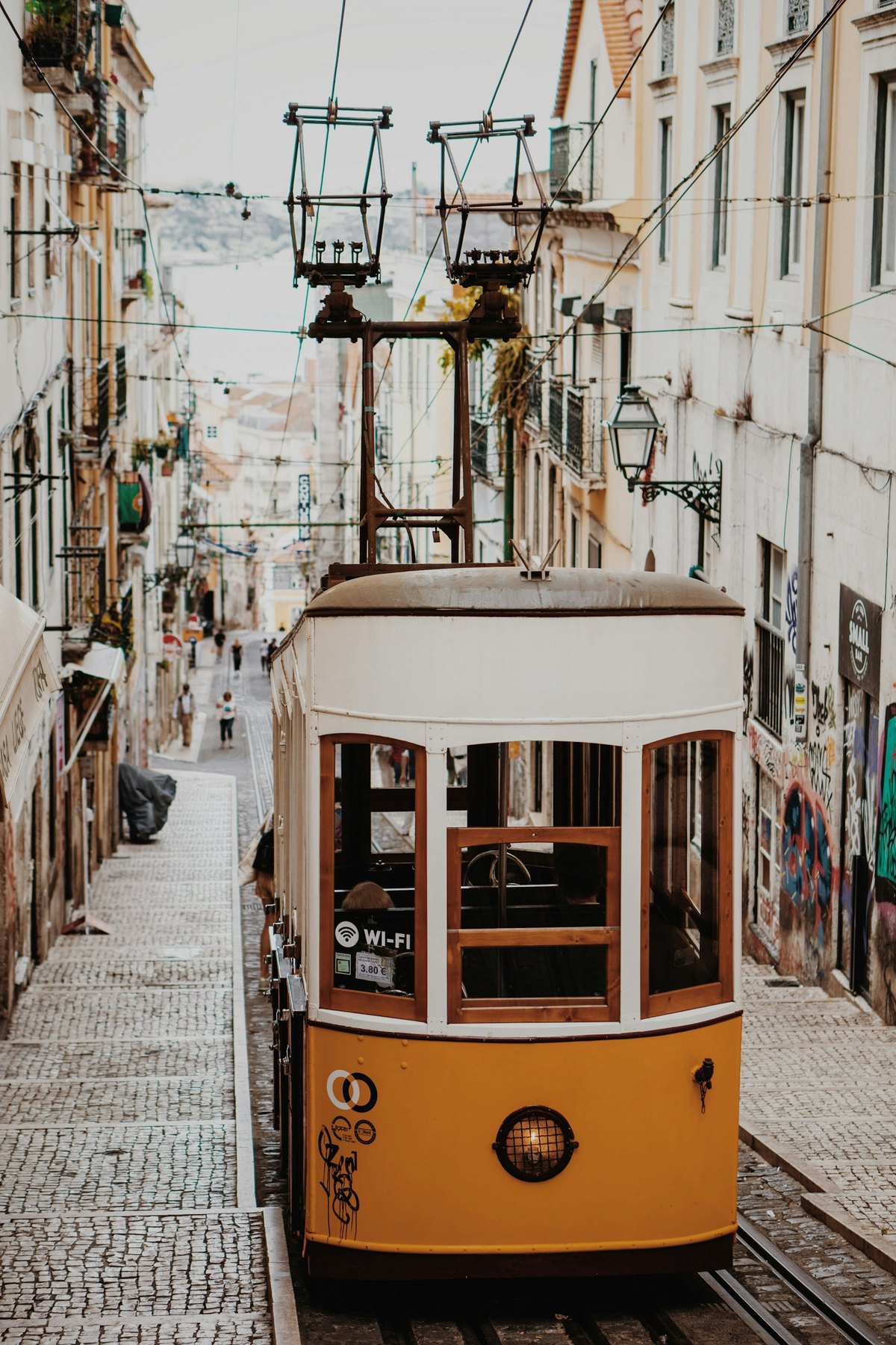 Yellow tram on a Lisbon street