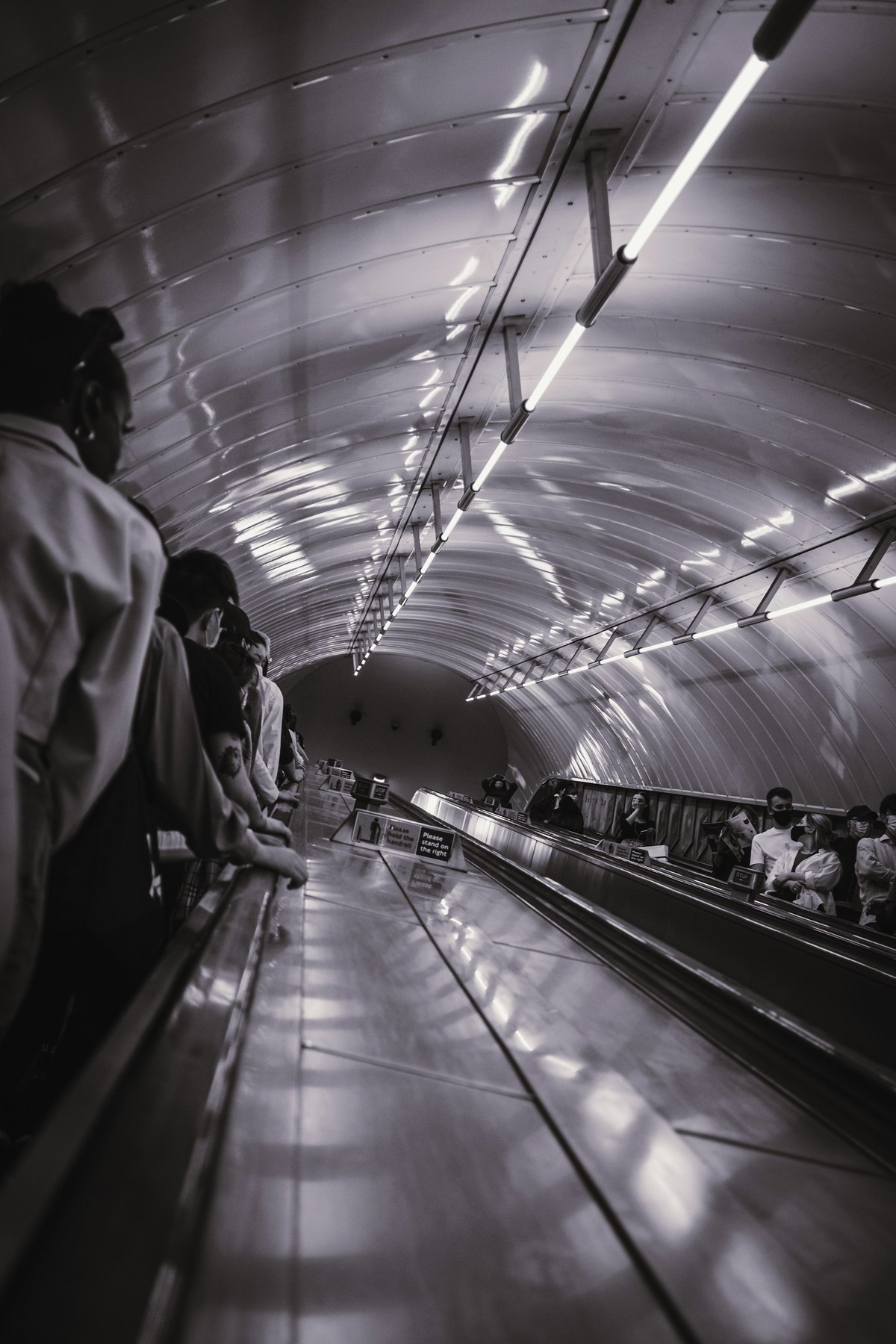 Passengers waiting on a London Underground platform