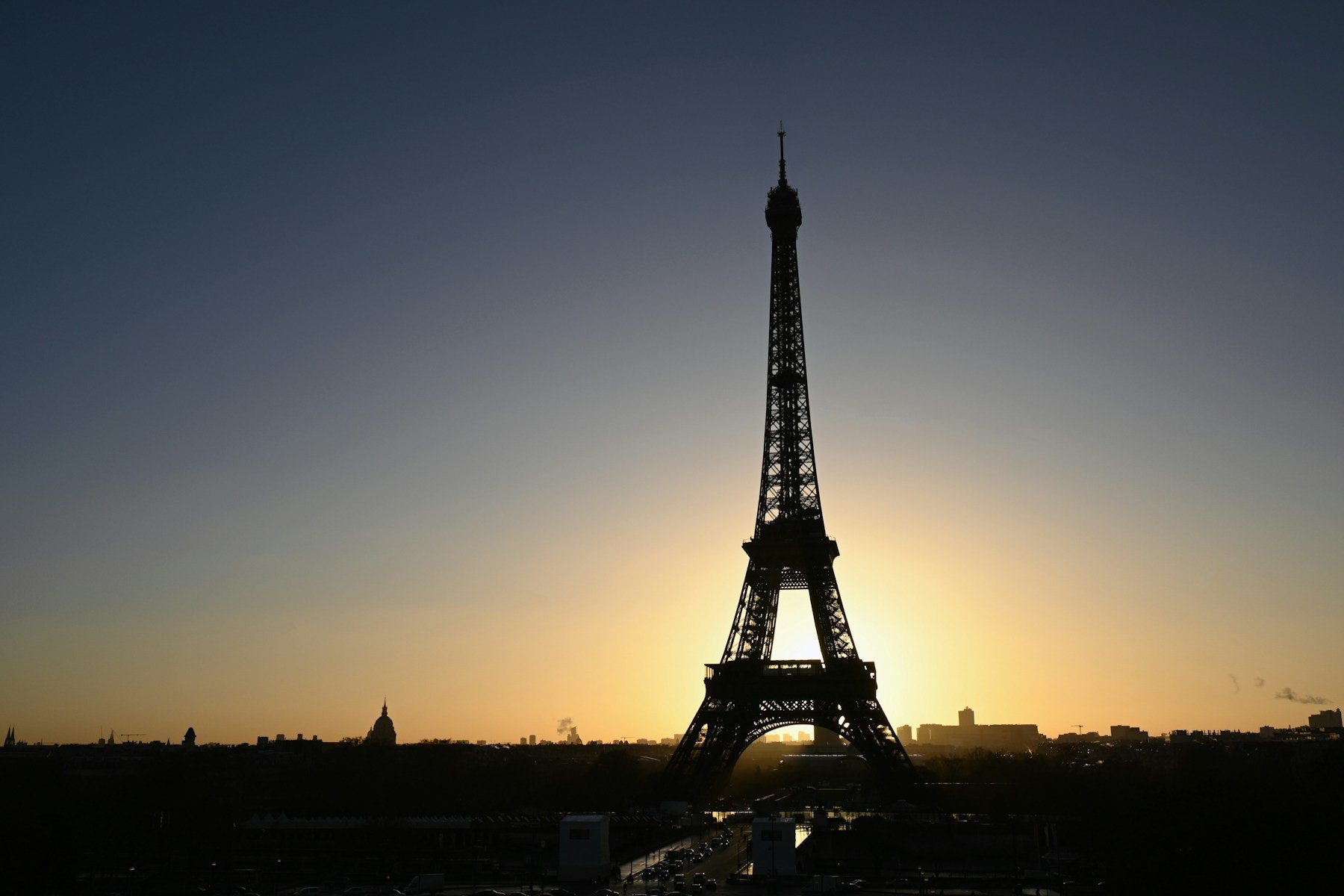 Eiffel Tower silhouetted against the evening sky