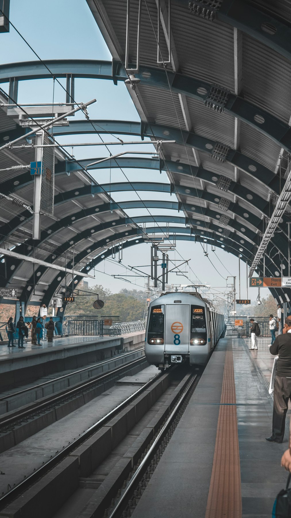 Passengers walking through a Porto Metro station