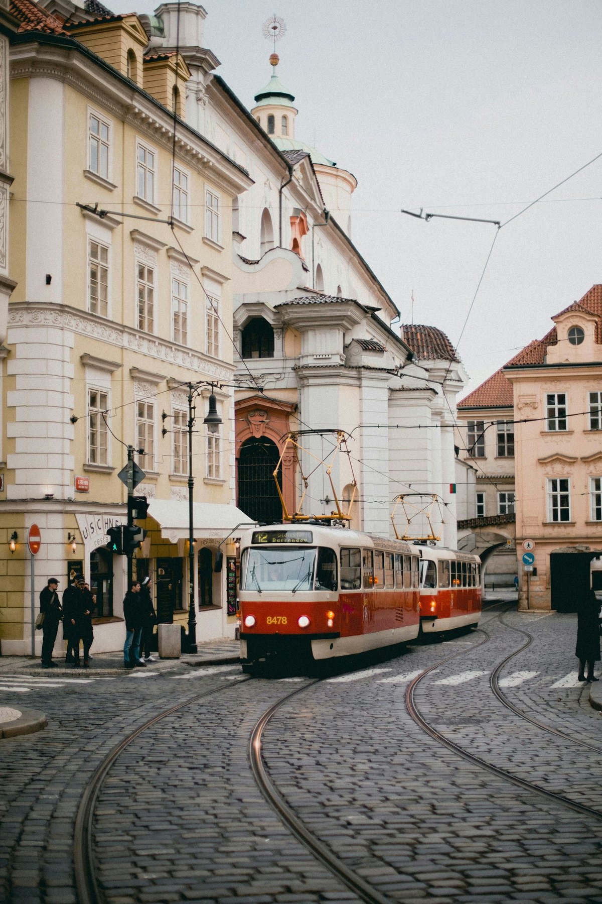 Red and white tram on a Prague street