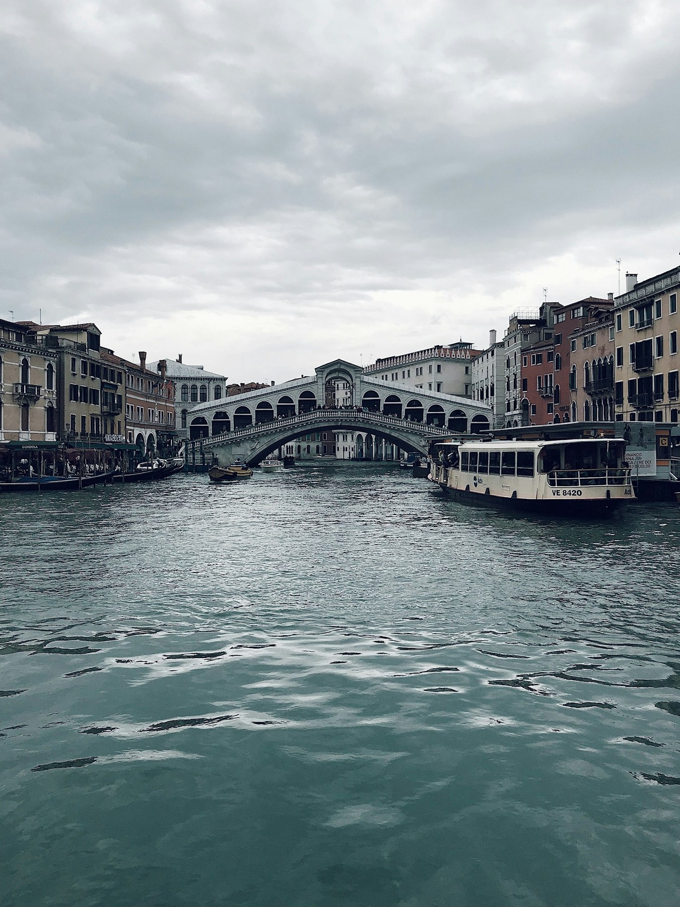 Water buses and other boats travelling along a Venice canal