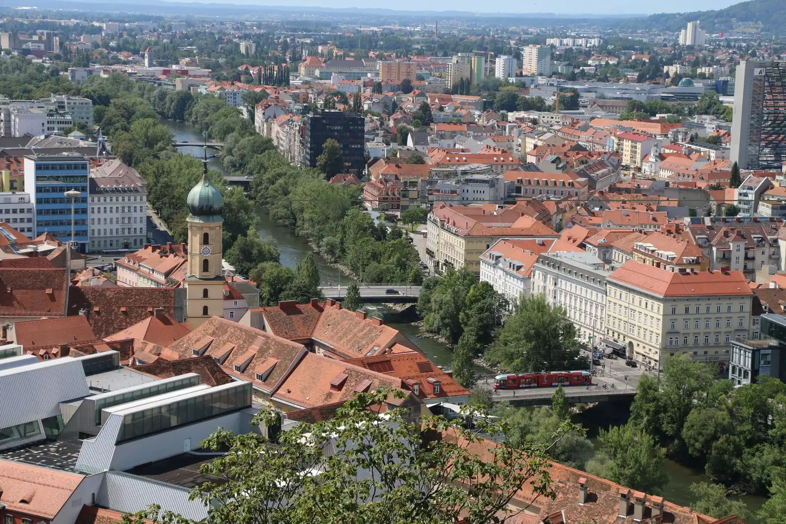 Graz's red rooftops along the Mur River