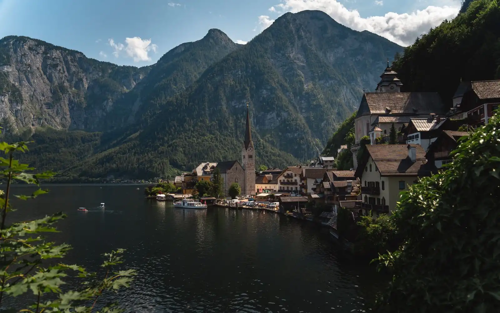 Hallstatt's church and lakeside houses below the mountains