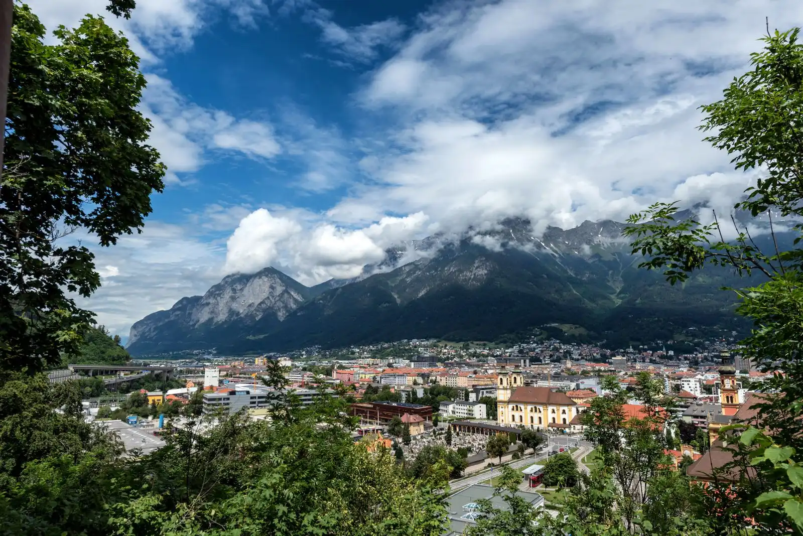 Innsbruck's buildings below the Alpine mountains
