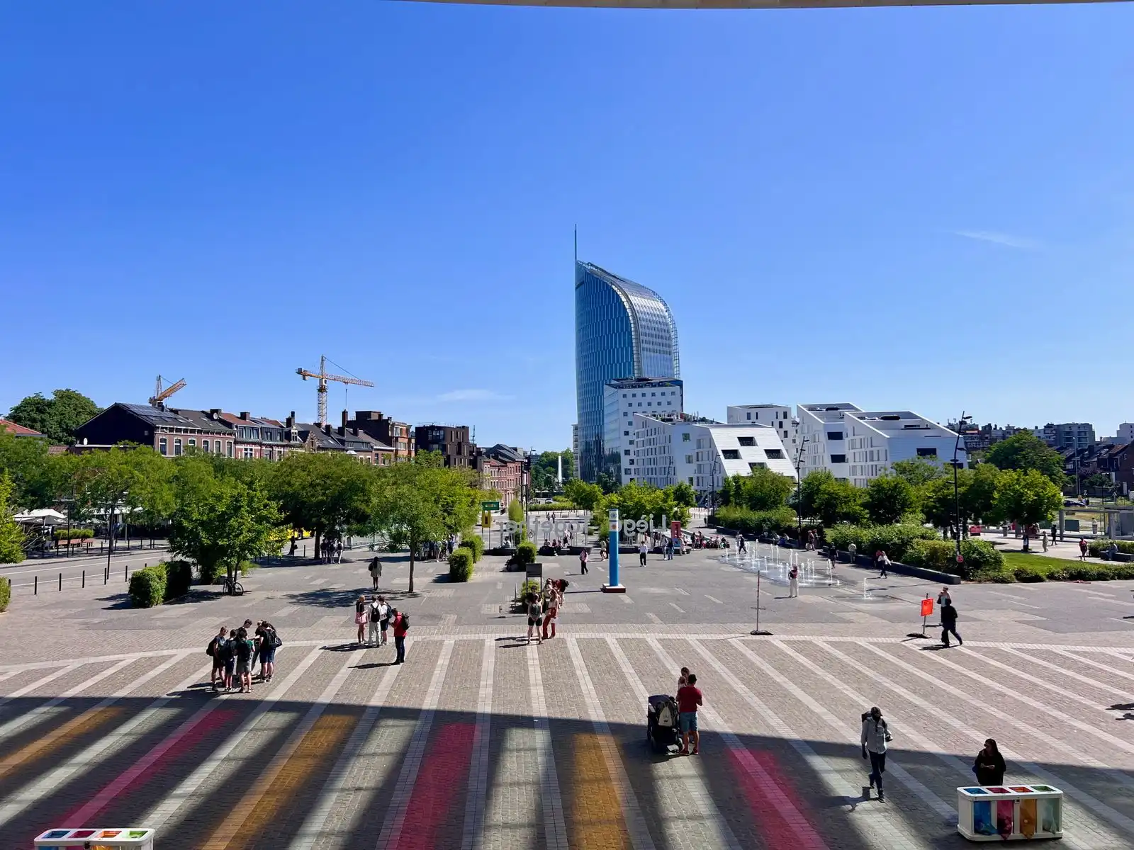 A city square and modern tower in Liège
