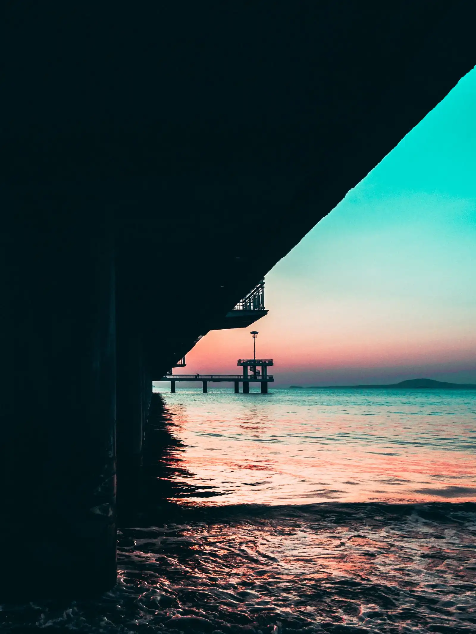 The pier at Burgas extending into the sea at sunset