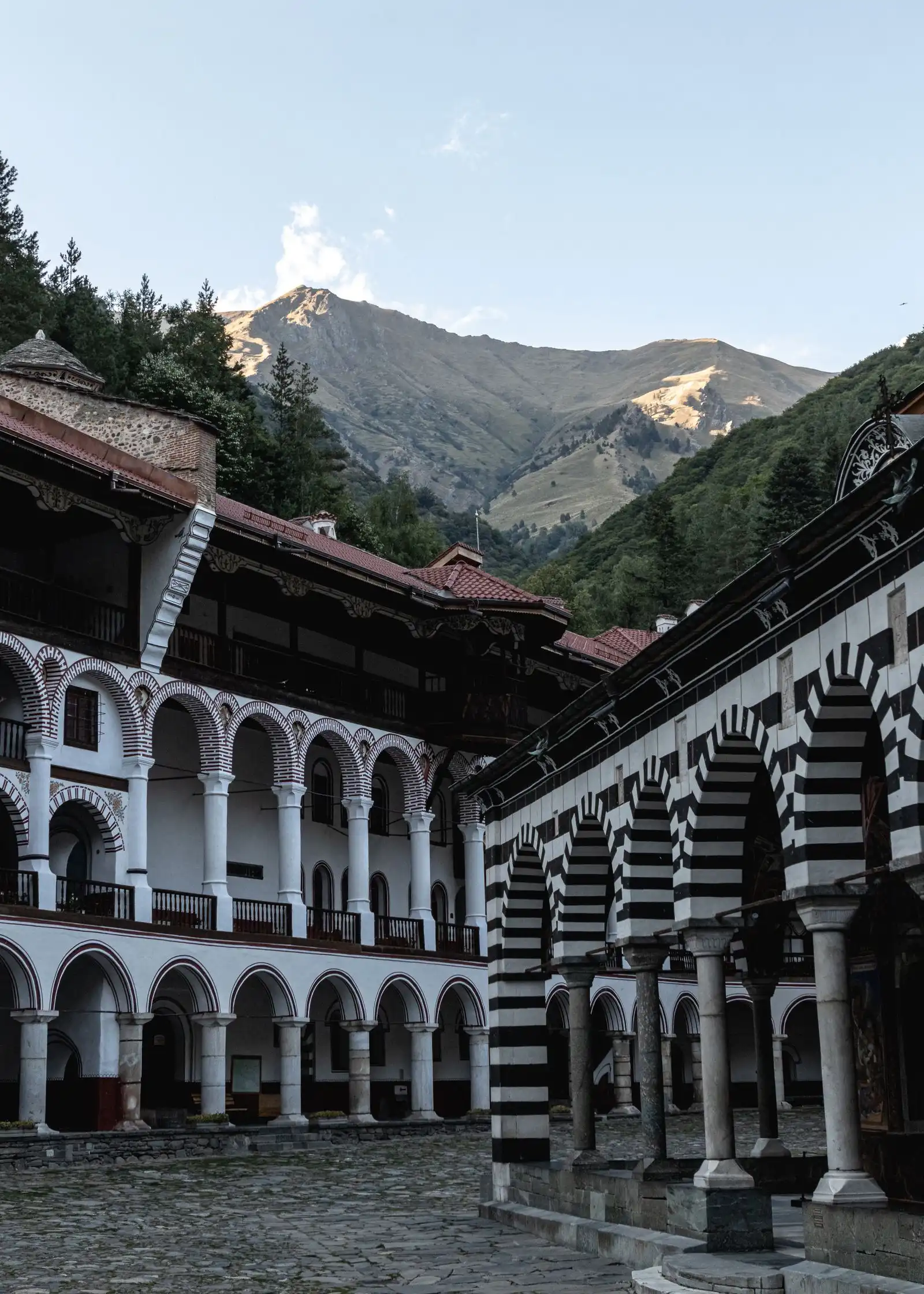 Rila Monastery's arcades below the mountains