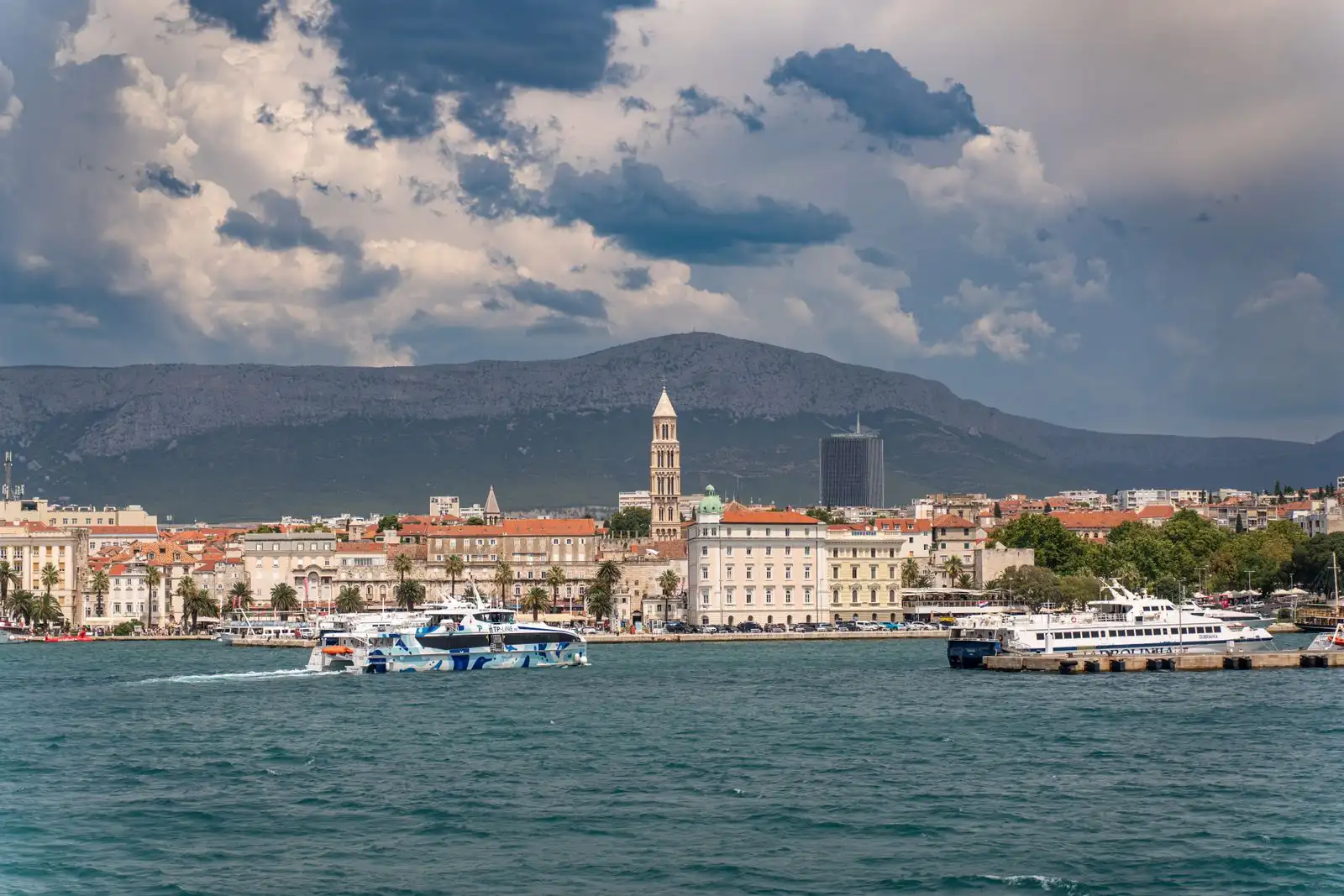 Split's waterfront buildings and bell tower beside the harbour