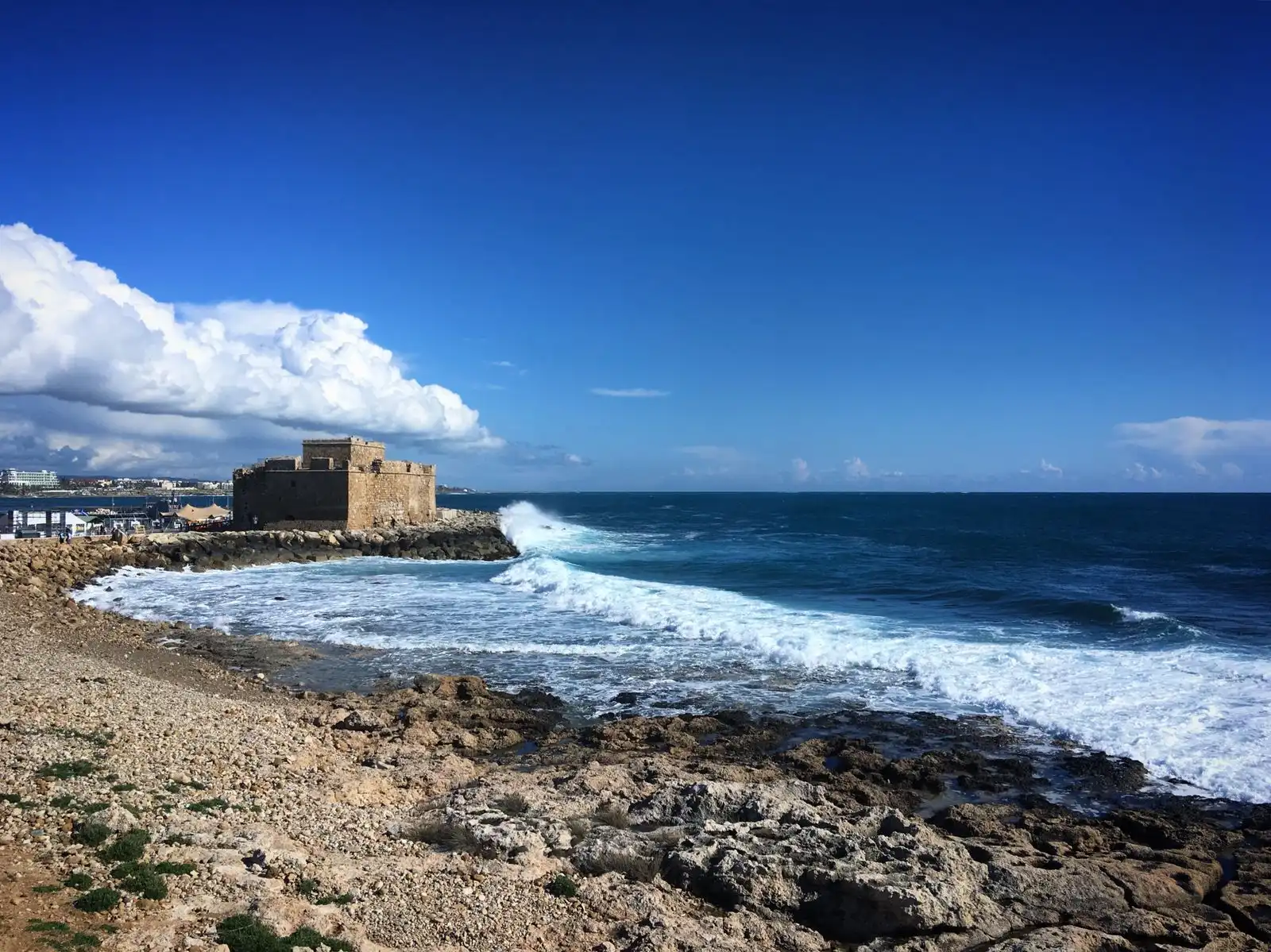 Paphos Castle beside waves breaking on the rocky shore