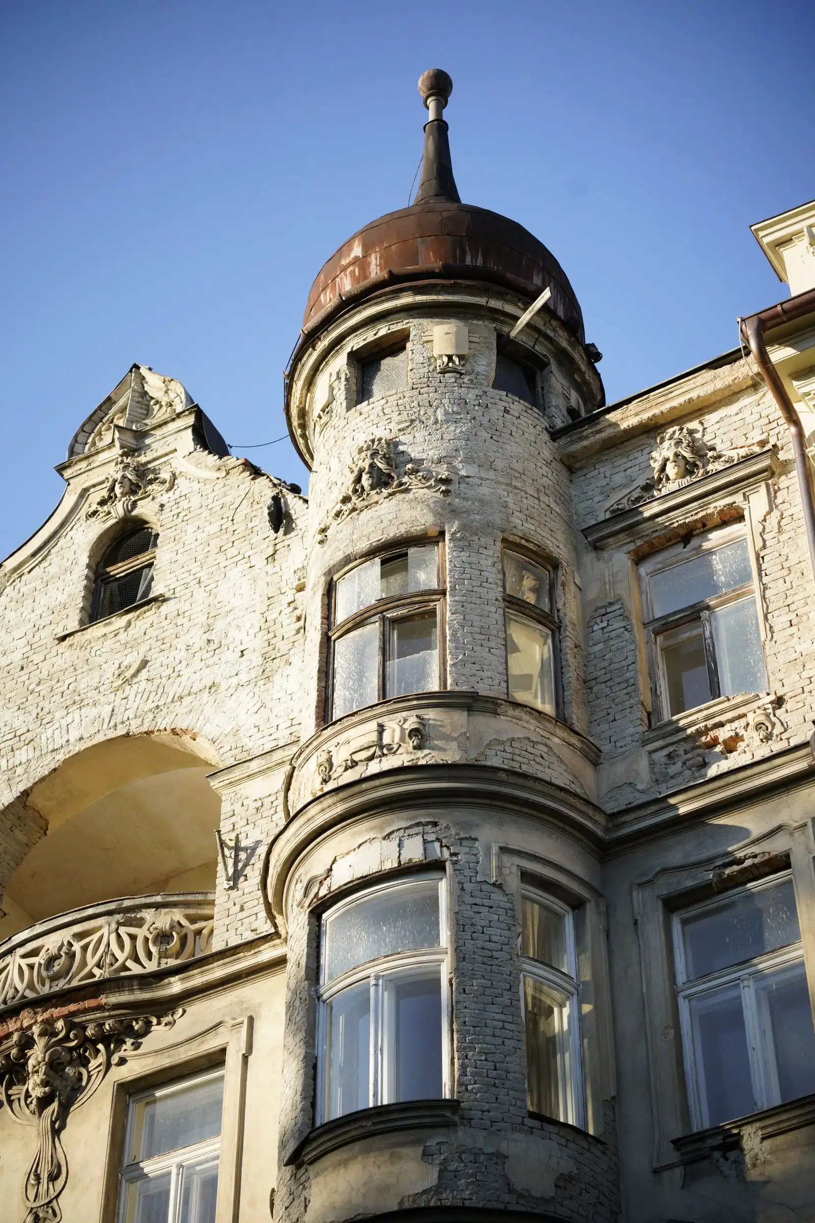 An ornate stone facade and turret in Olomouc