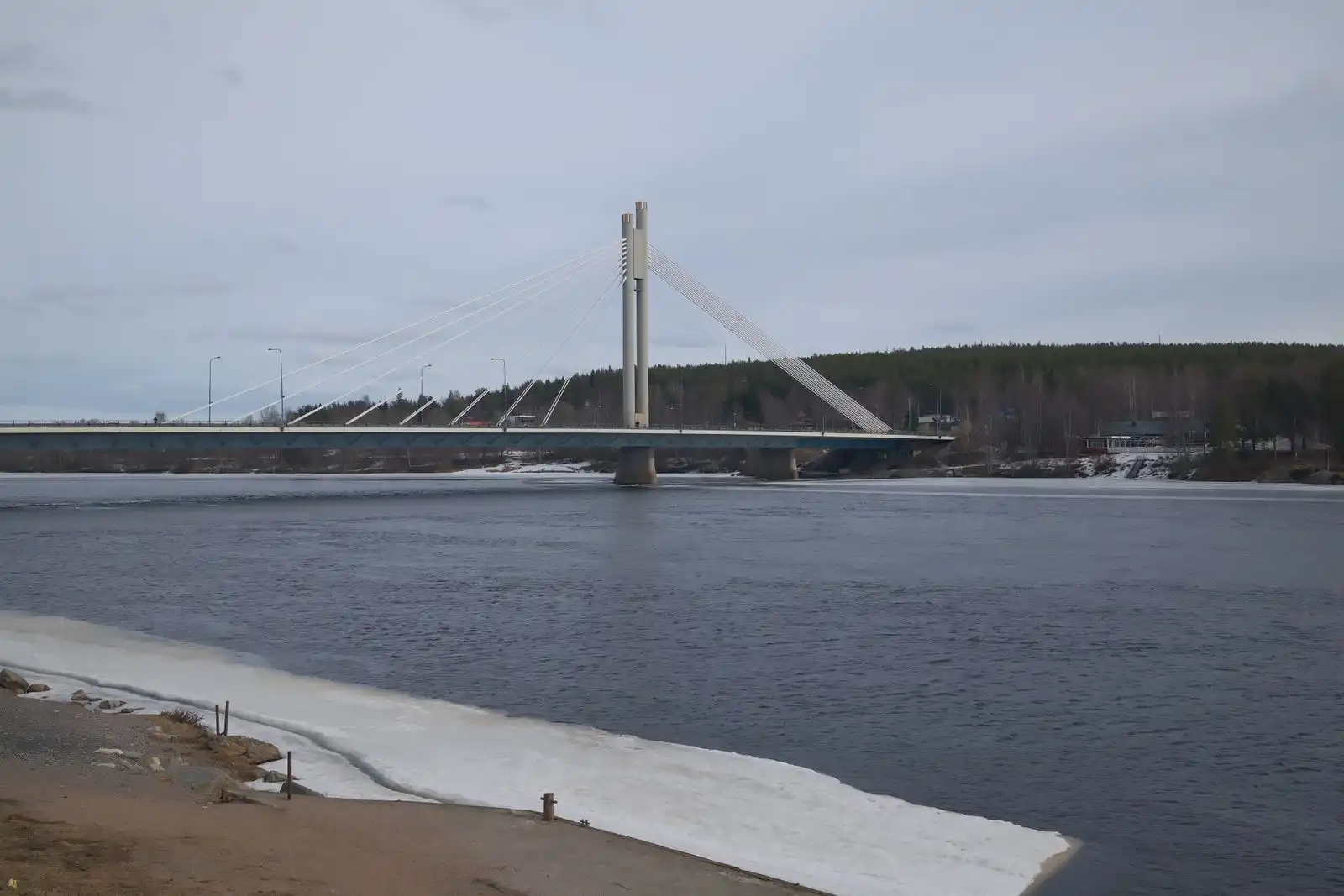 A cable-stayed bridge over the river in Rovaniemi in winter