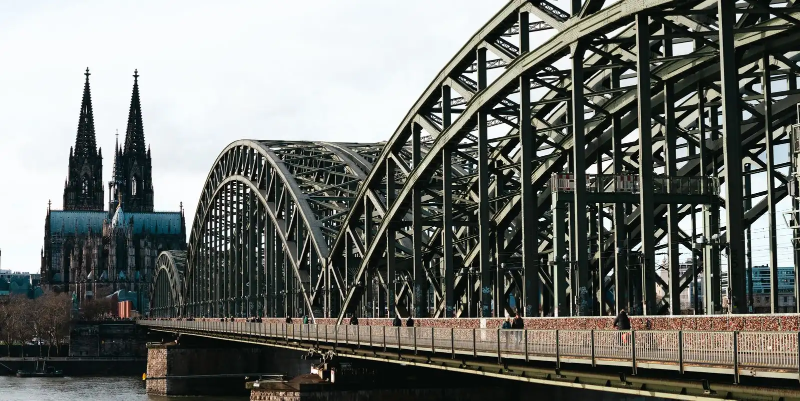 Cologne Cathedral and Hohenzollern Bridge beside the Rhine