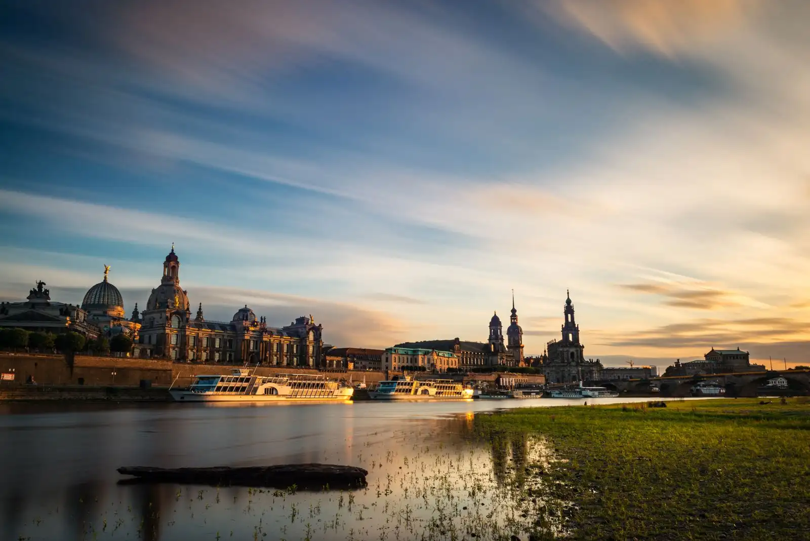 Dresden's illuminated skyline reflected in the Elbe