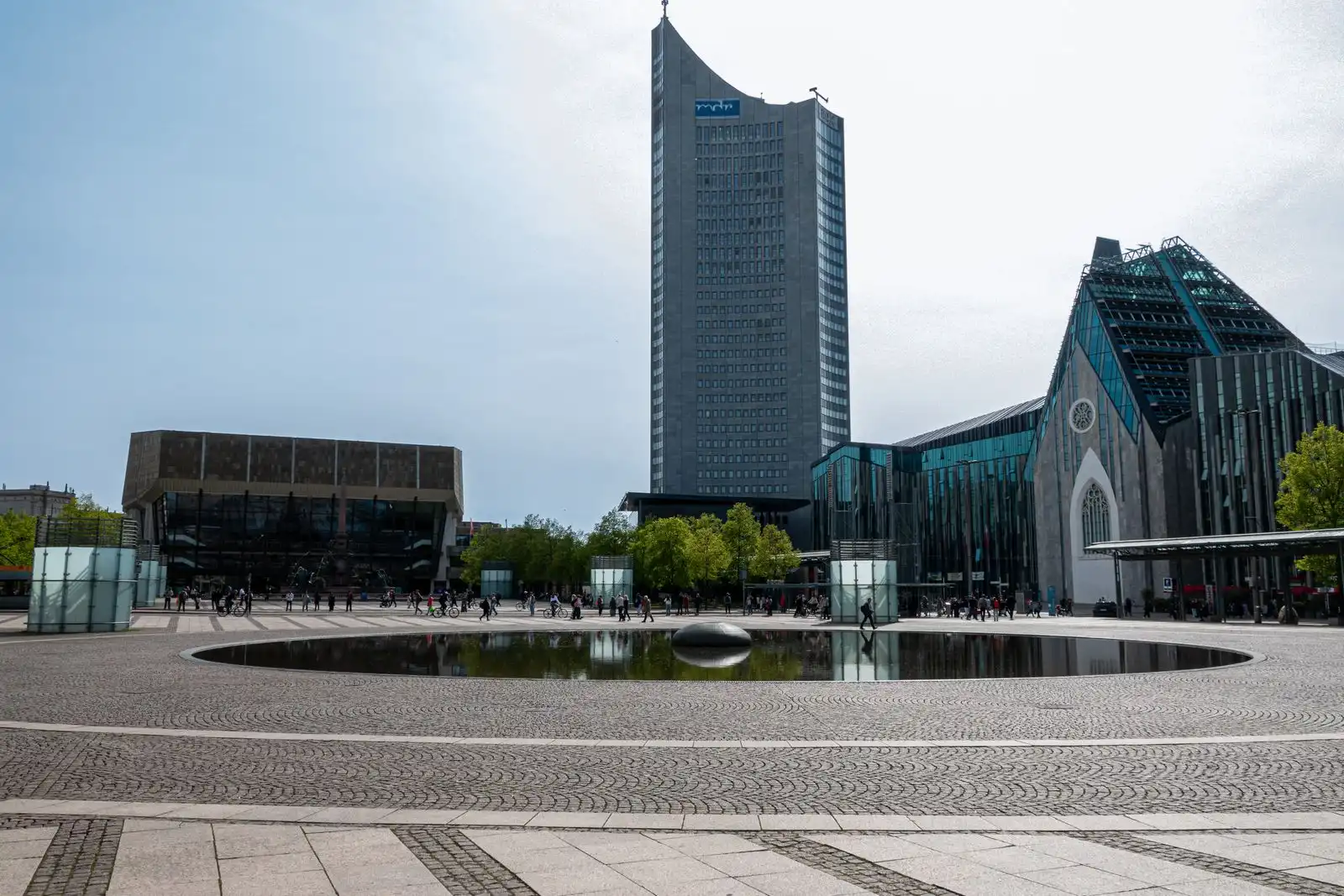 Modern buildings beside the reflecting pool on Leipzig's Augustusplatz