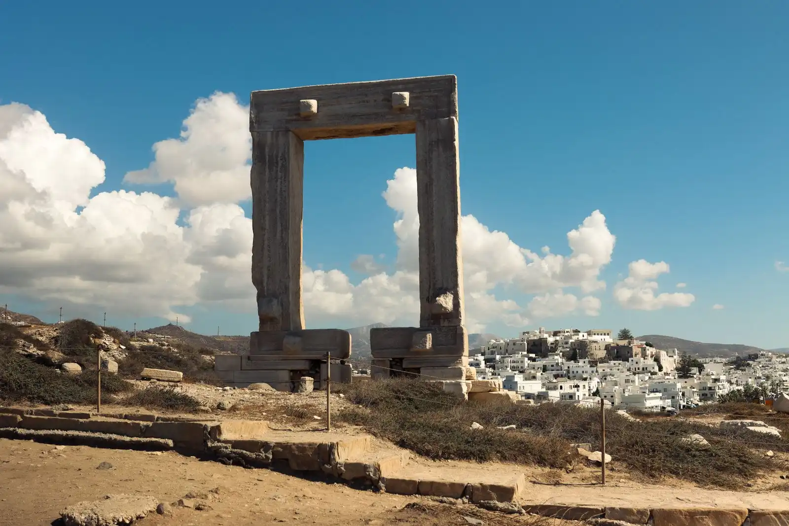 The Portara stone gateway with Naxos town across the water