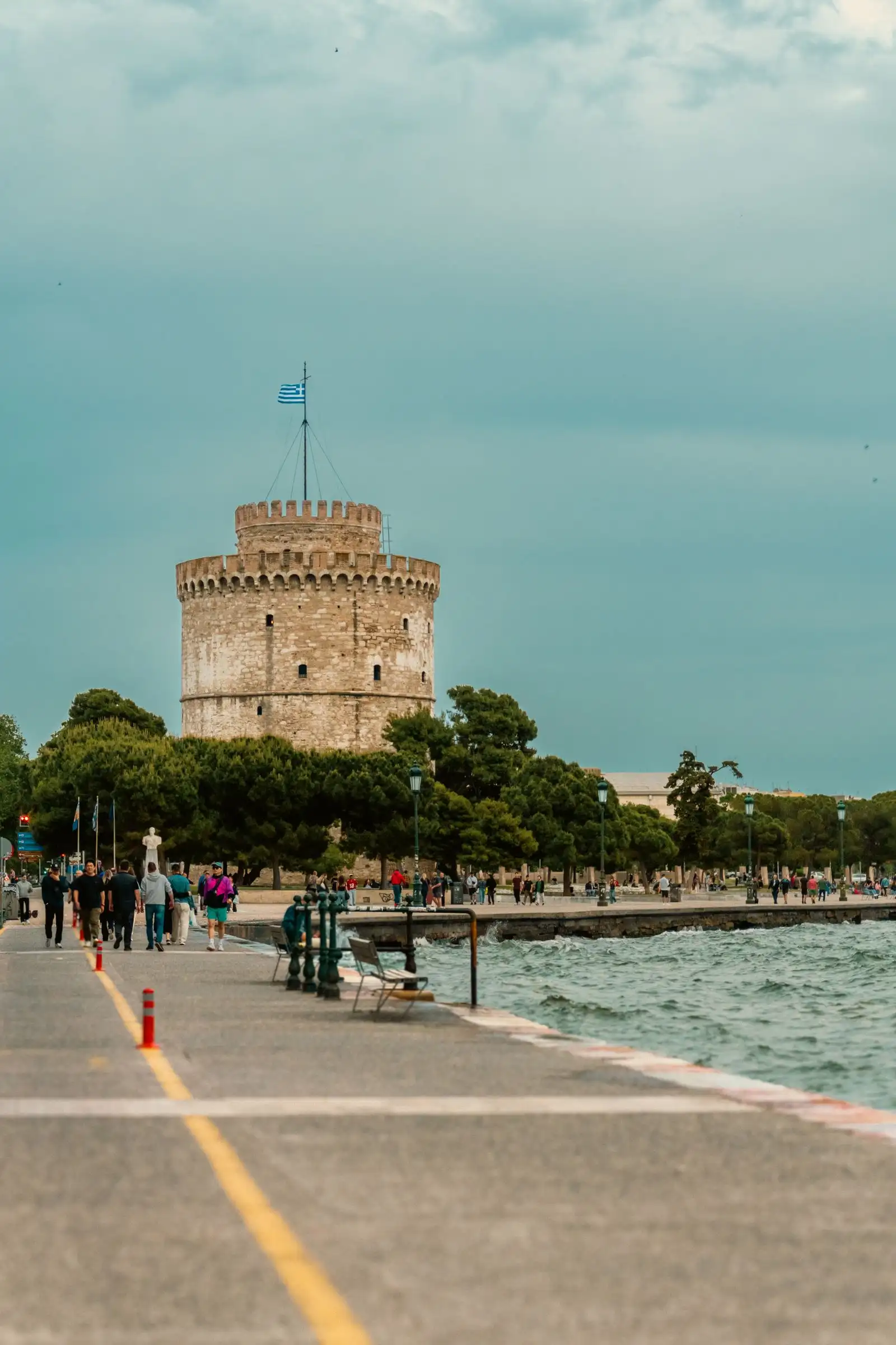 Thessaloniki's White Tower rising above trees by the waterfront