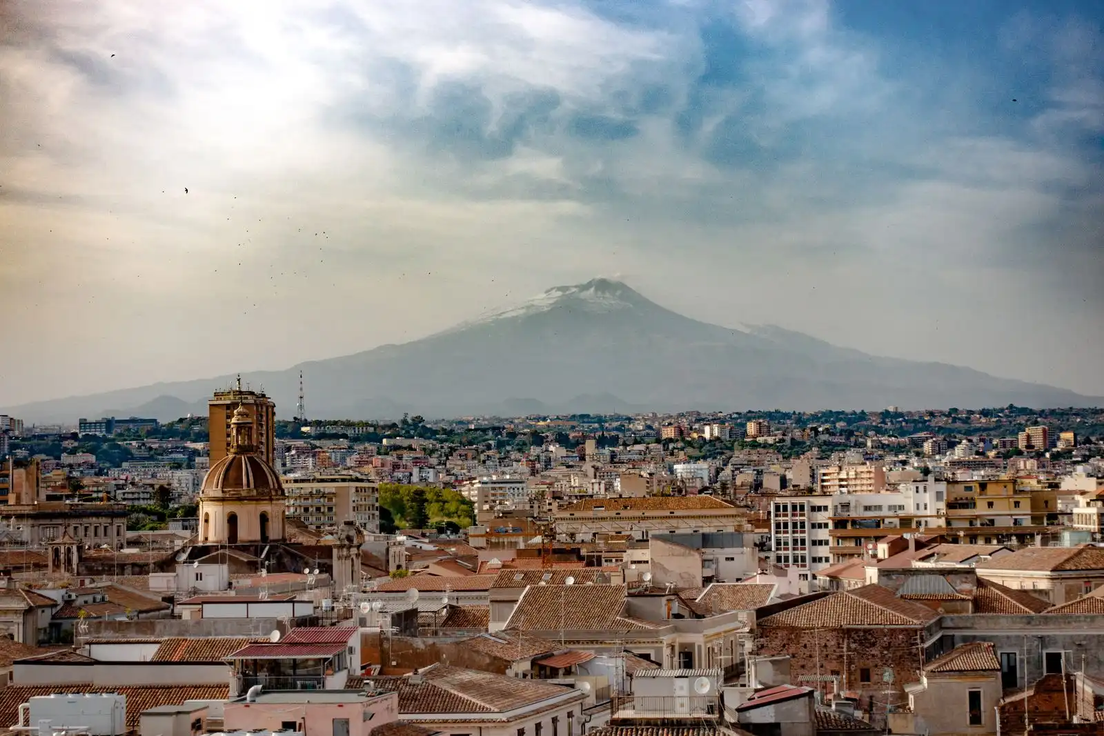 Catania's rooftops with Mount Etna in the distance