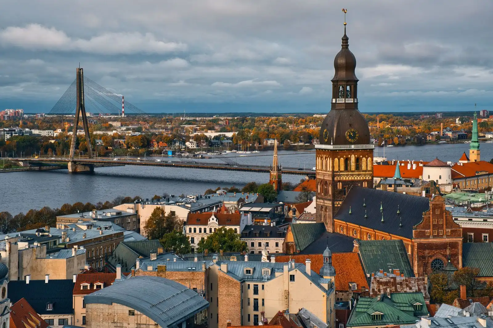 Riga's old town rooftops and church tower beside the Daugava