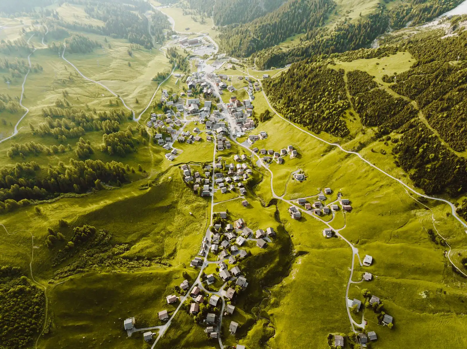 Malbun's village buildings among green Alpine slopes