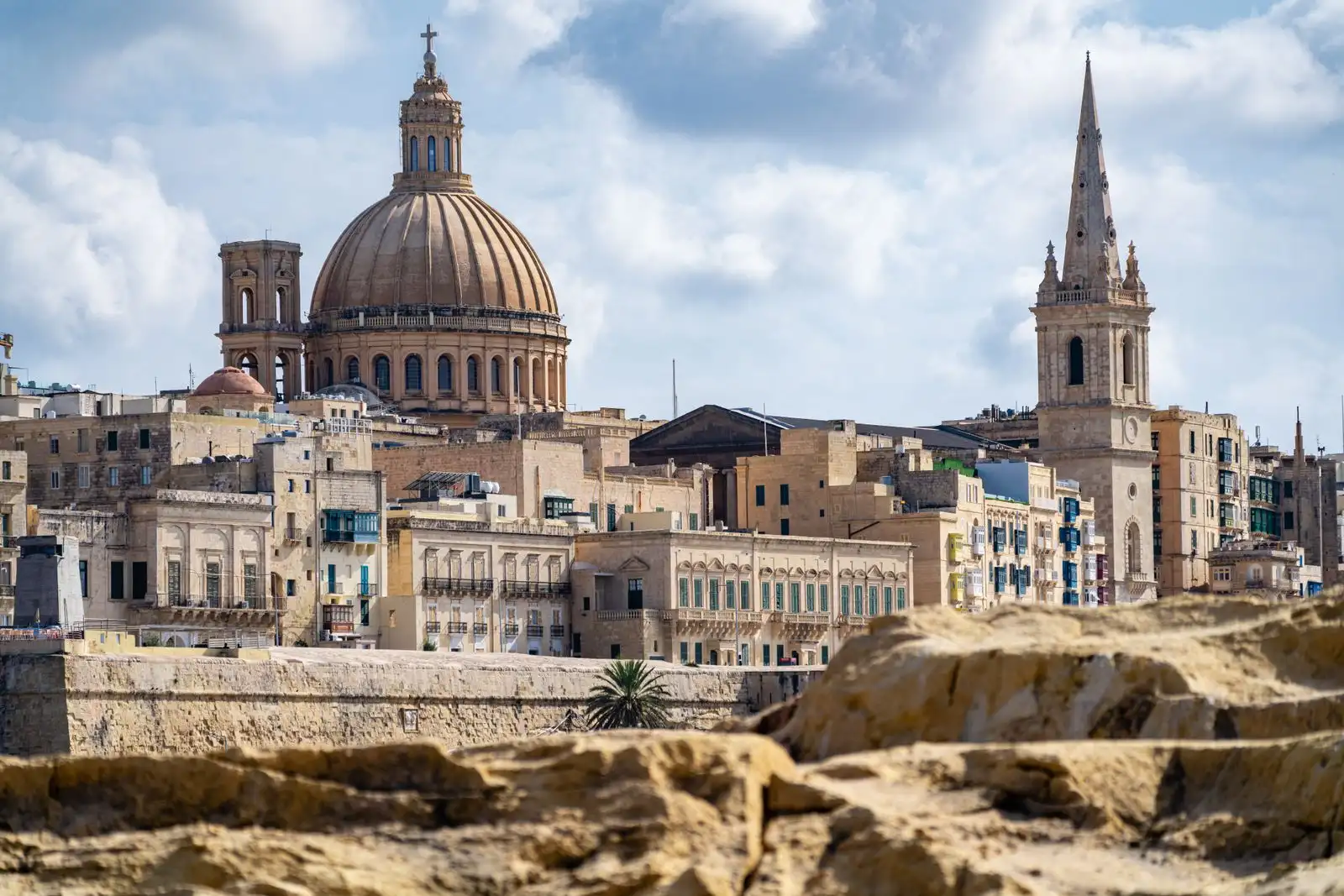 Valletta's limestone buildings, church dome and spire