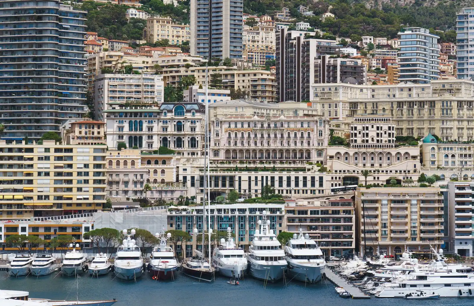 Yachts below Monaco's waterfront buildings