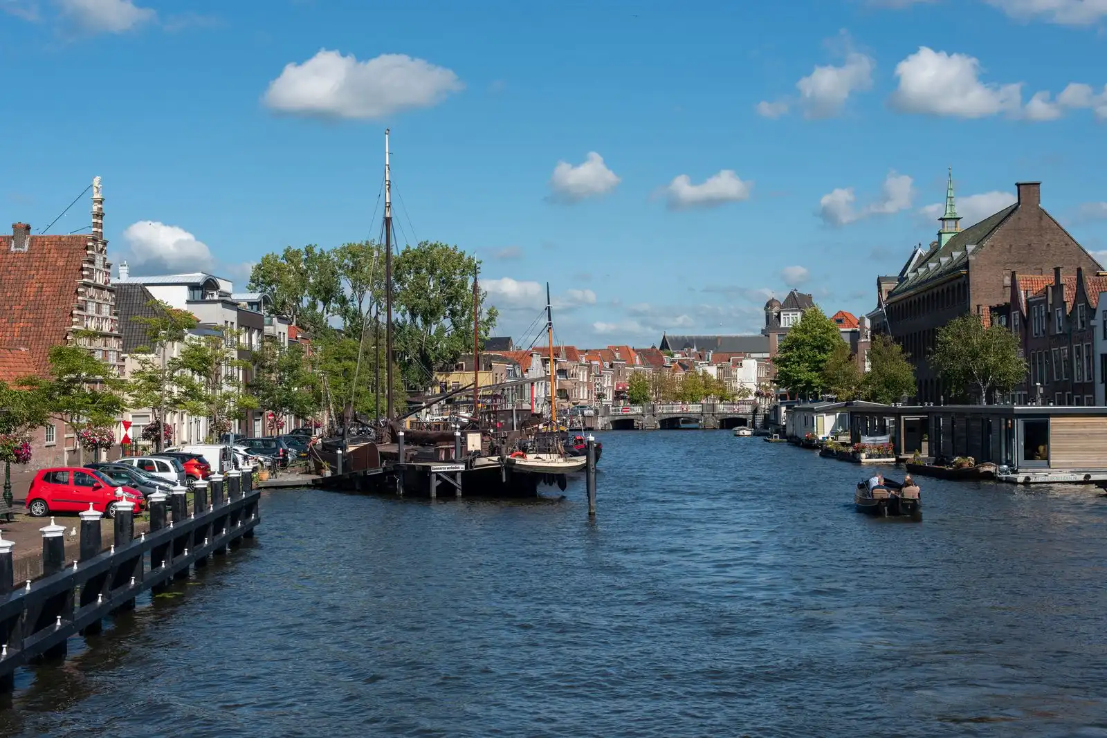 Boats along a canal beside historic buildings in Leiden