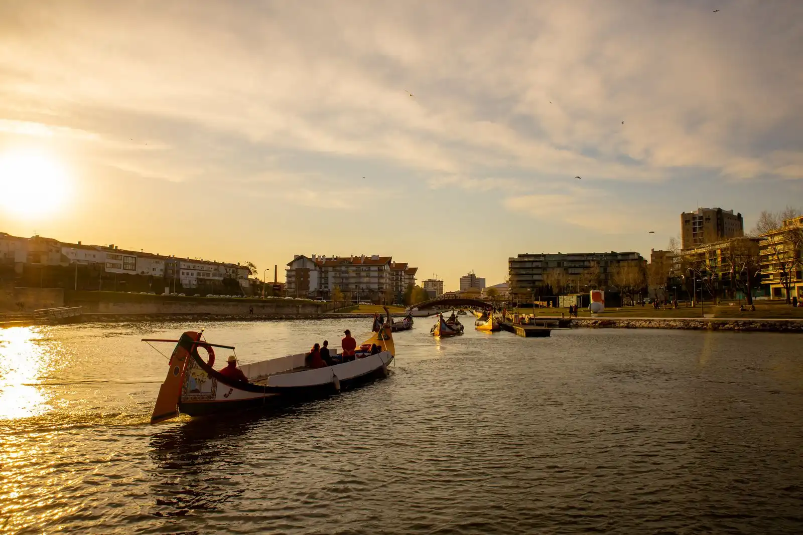 Traditional boats on the water in Aveiro at sunset