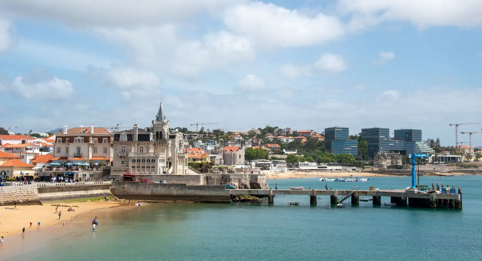 Cascais's waterfront buildings beside a sandy beach