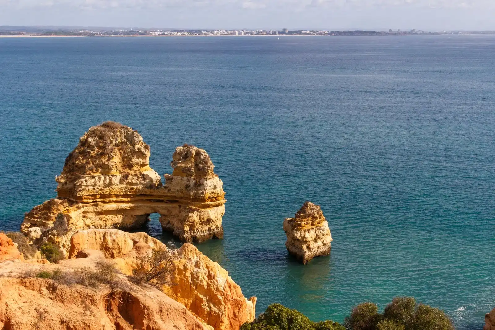 Golden rock formations above the sea near Lagos