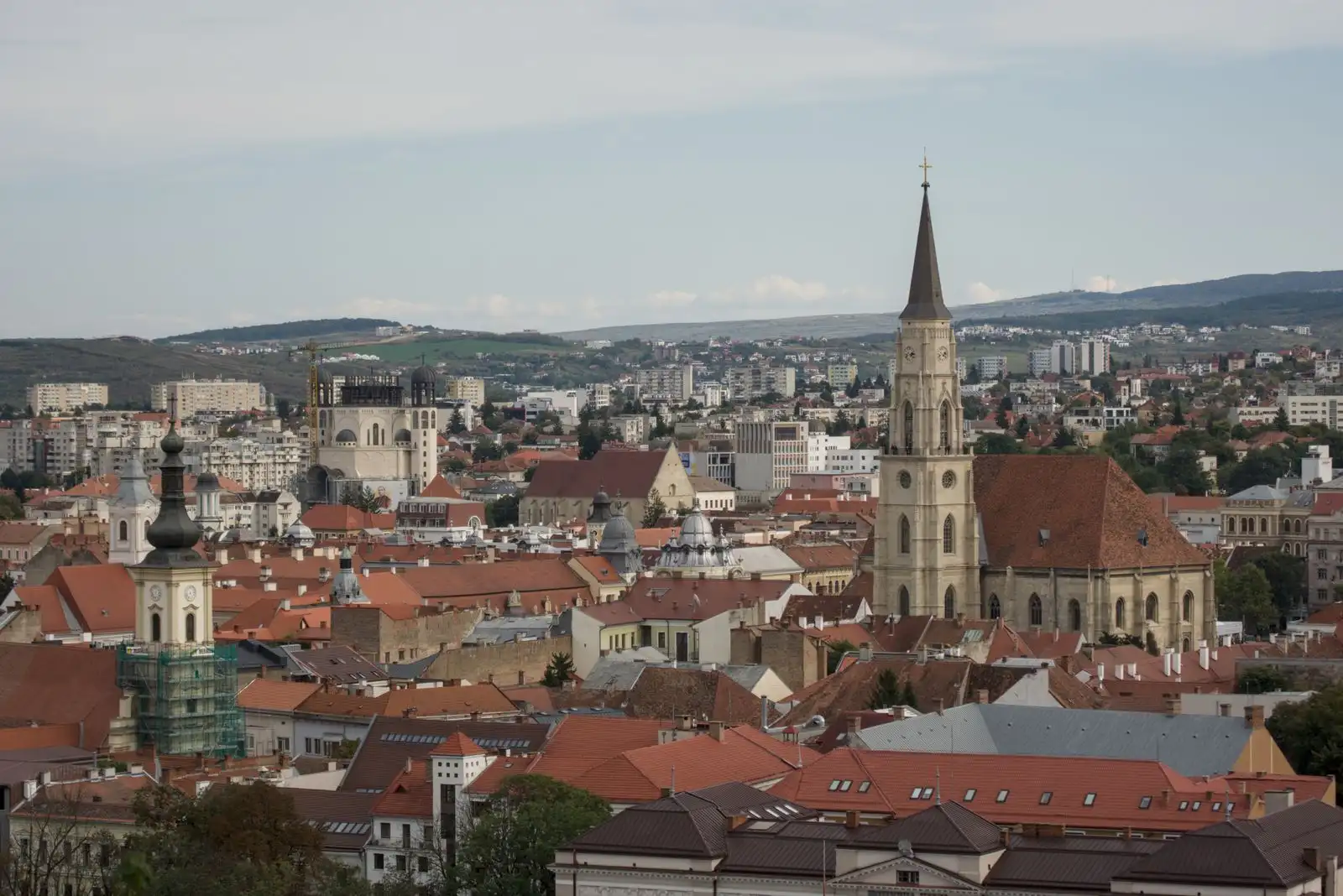 A church tower above the rooftops of Cluj-Napoca
