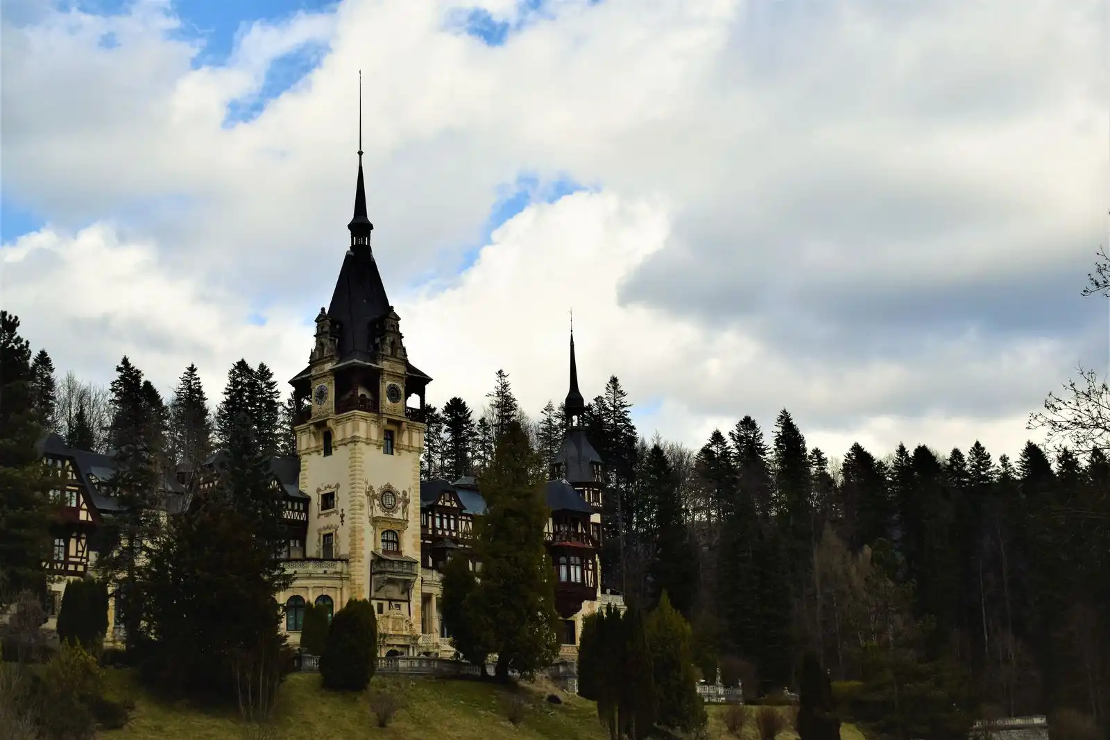 Peleș Castle among trees in Sinaia
