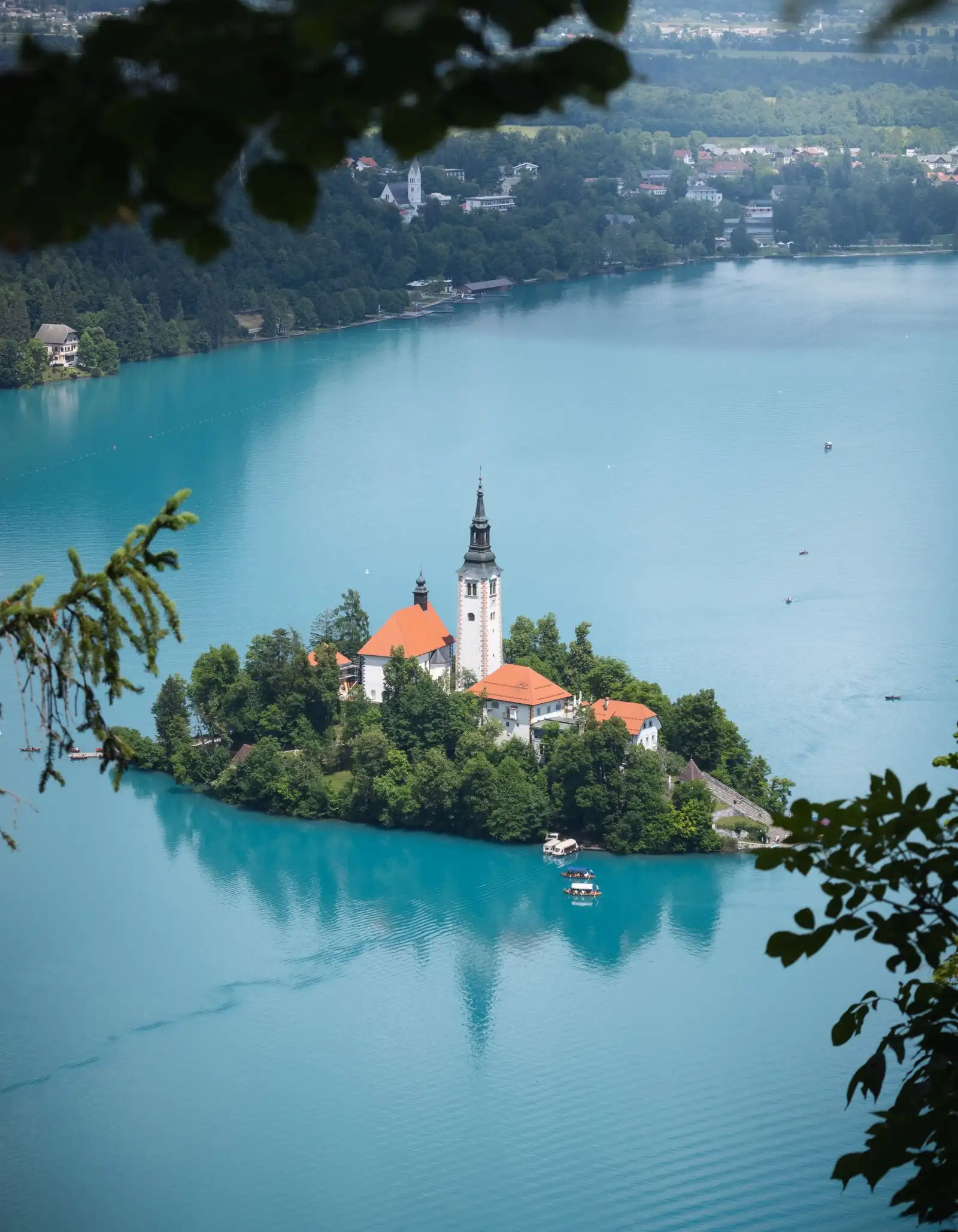 The island church surrounded by the water of Lake Bled