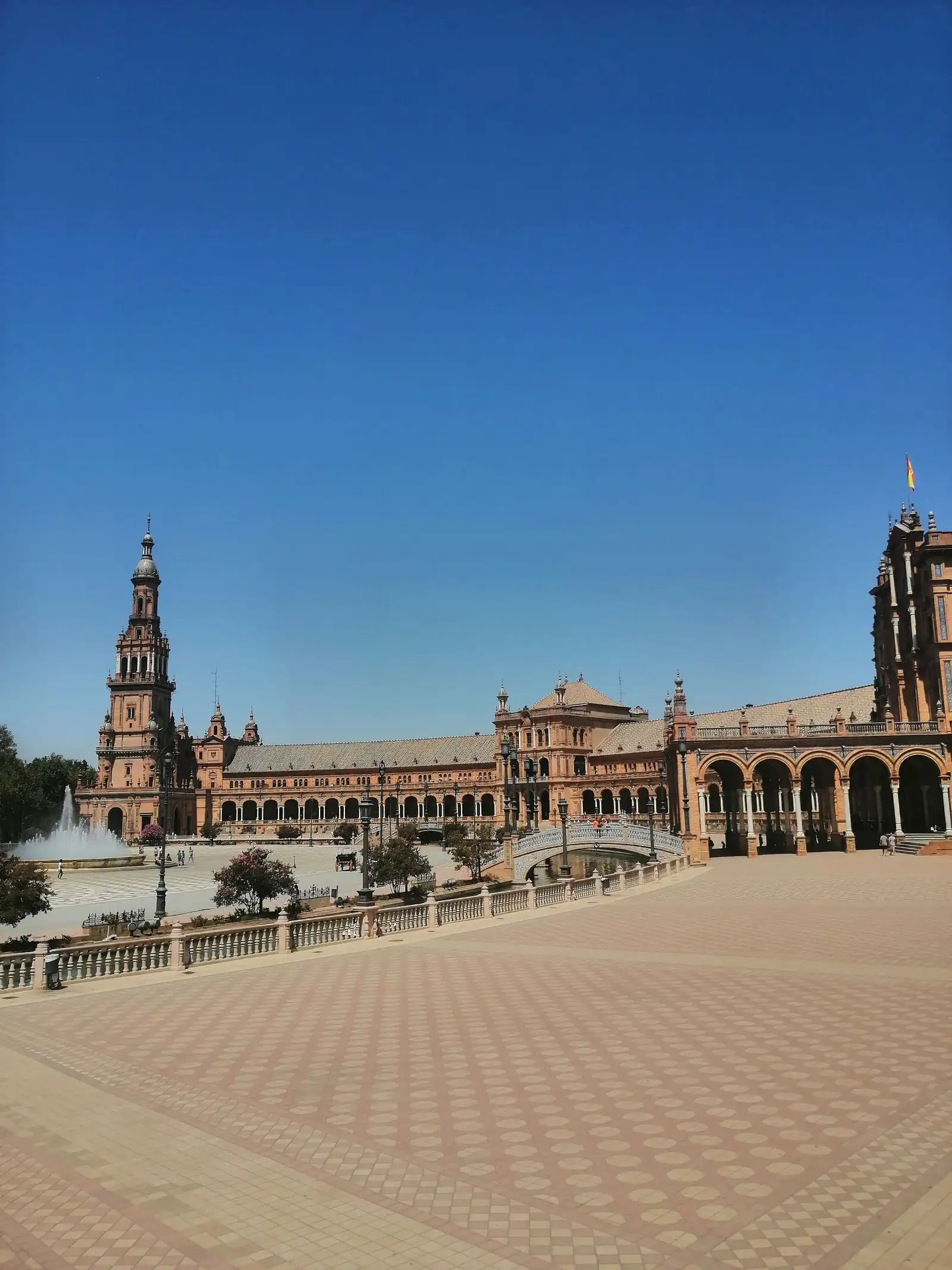 The towers and curved buildings of Plaza de España in Seville