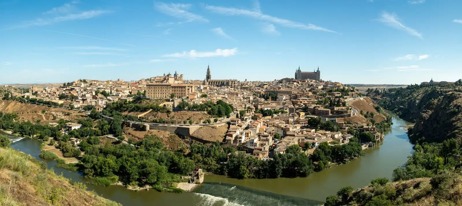 Toledo's historic skyline above a bend in the Tagus River