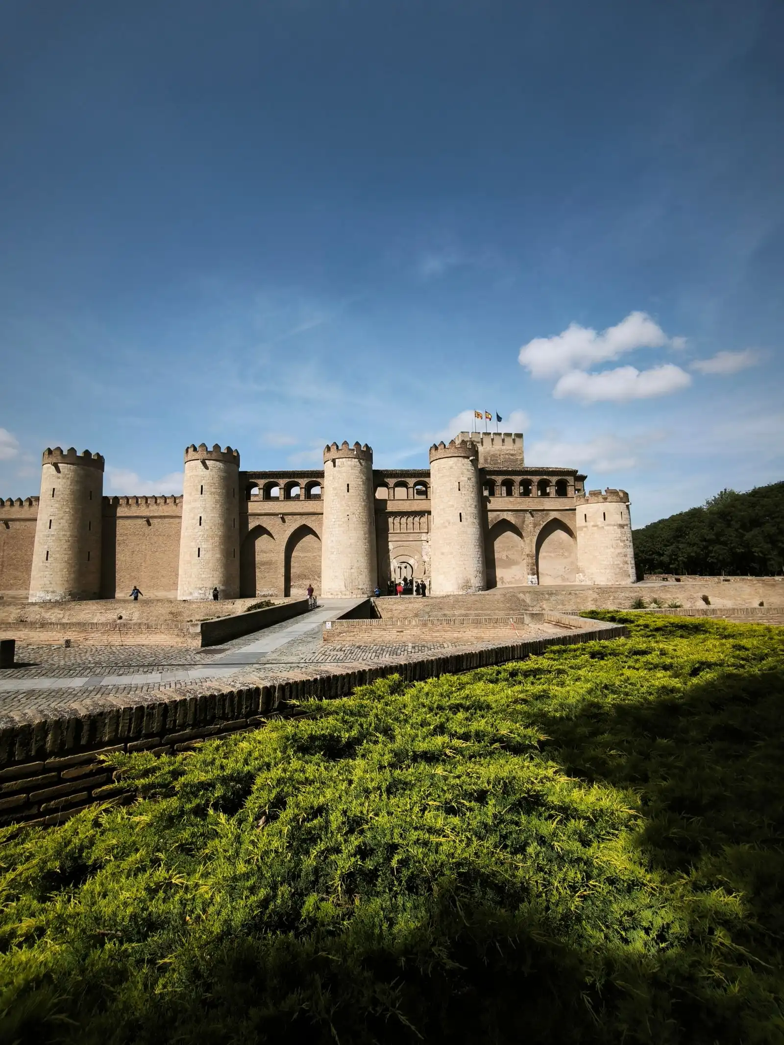 Stone walls and towers of Aljafería Palace in Zaragoza