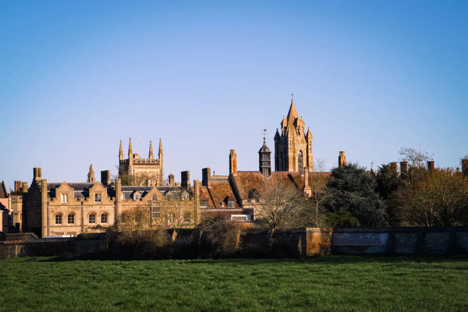 Oxford's historic university buildings beside a lawn