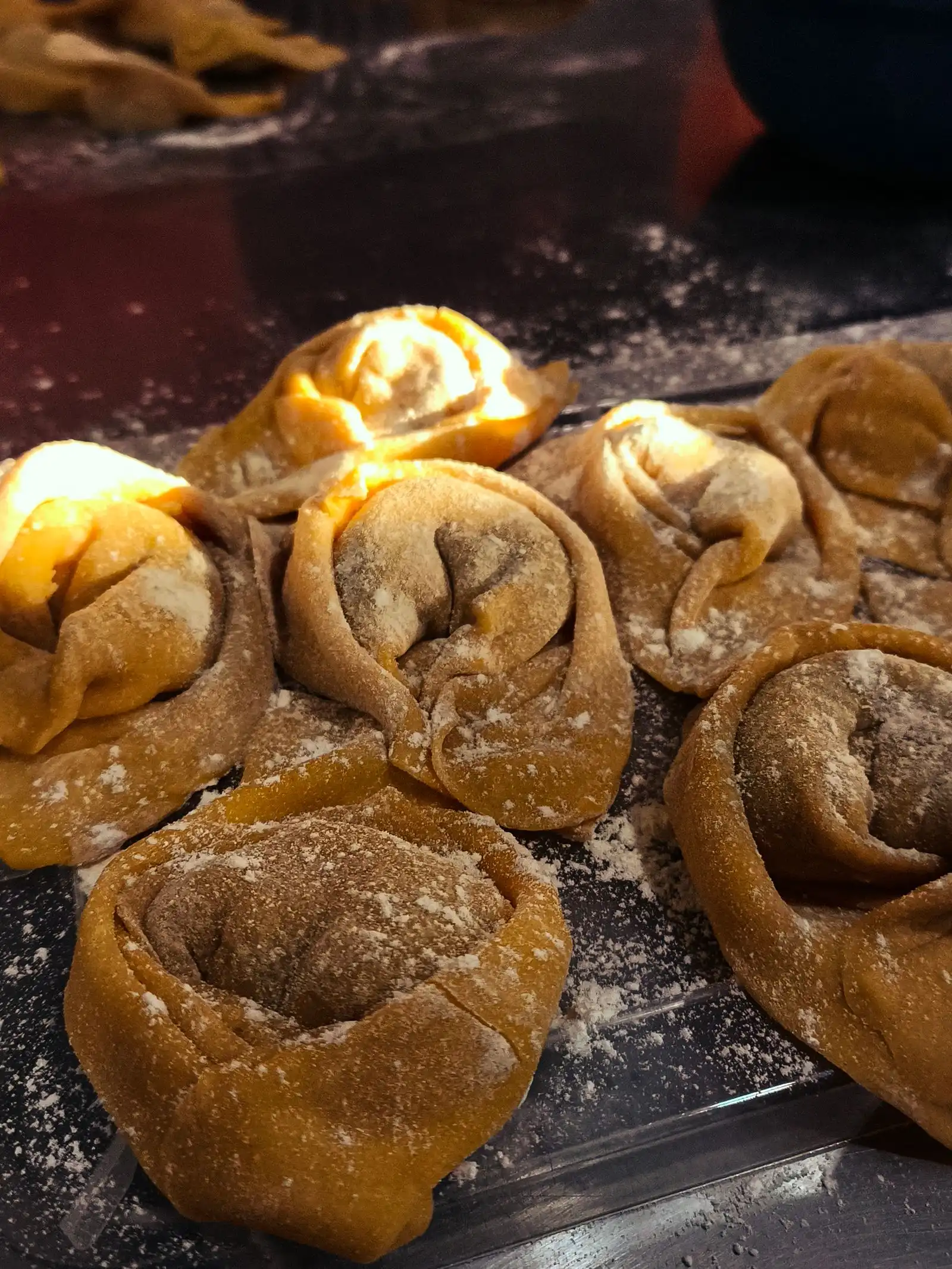 Fresh tortellini dusted with flour