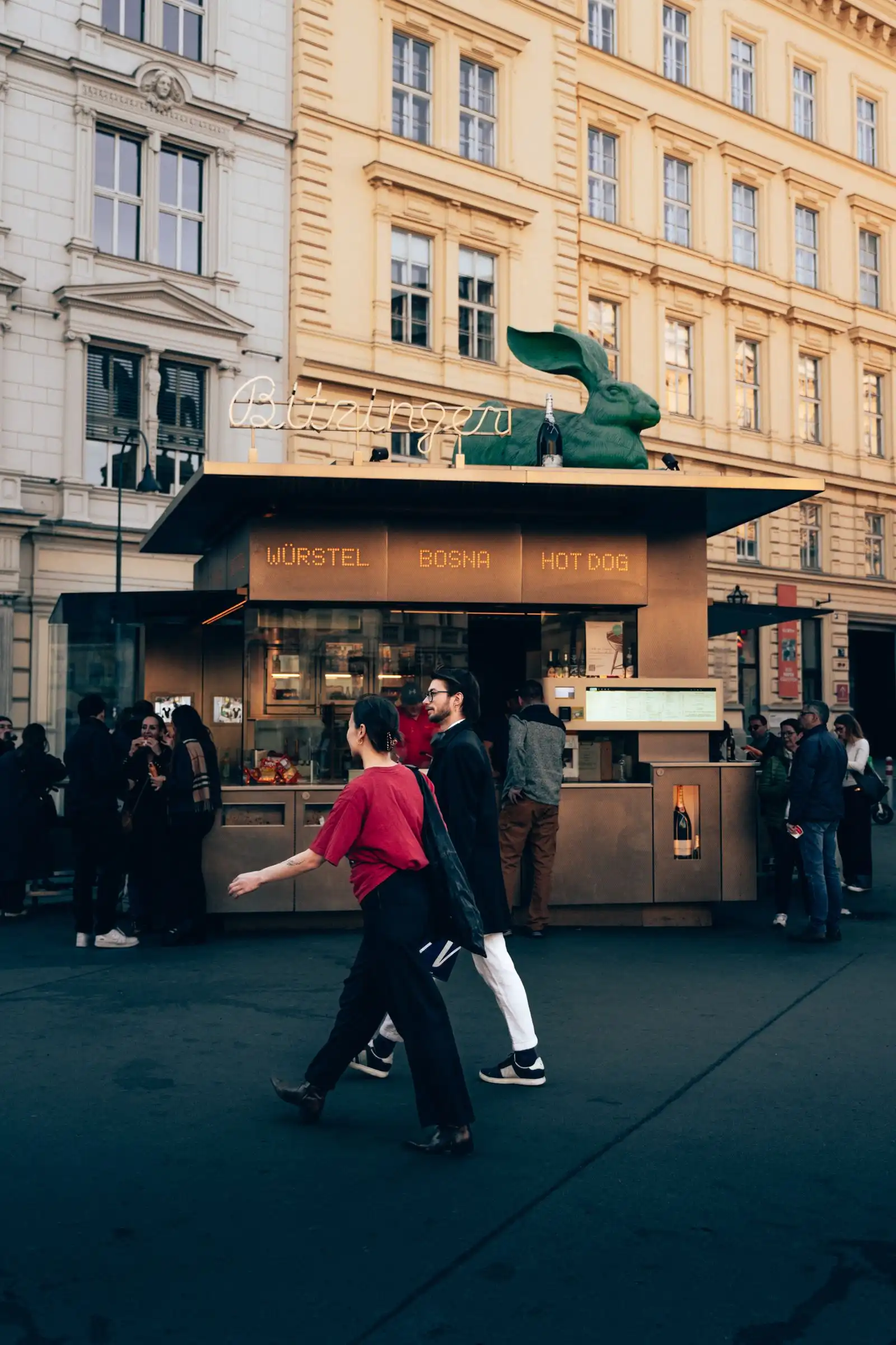 Customers at a sausage stand on a Vienna street