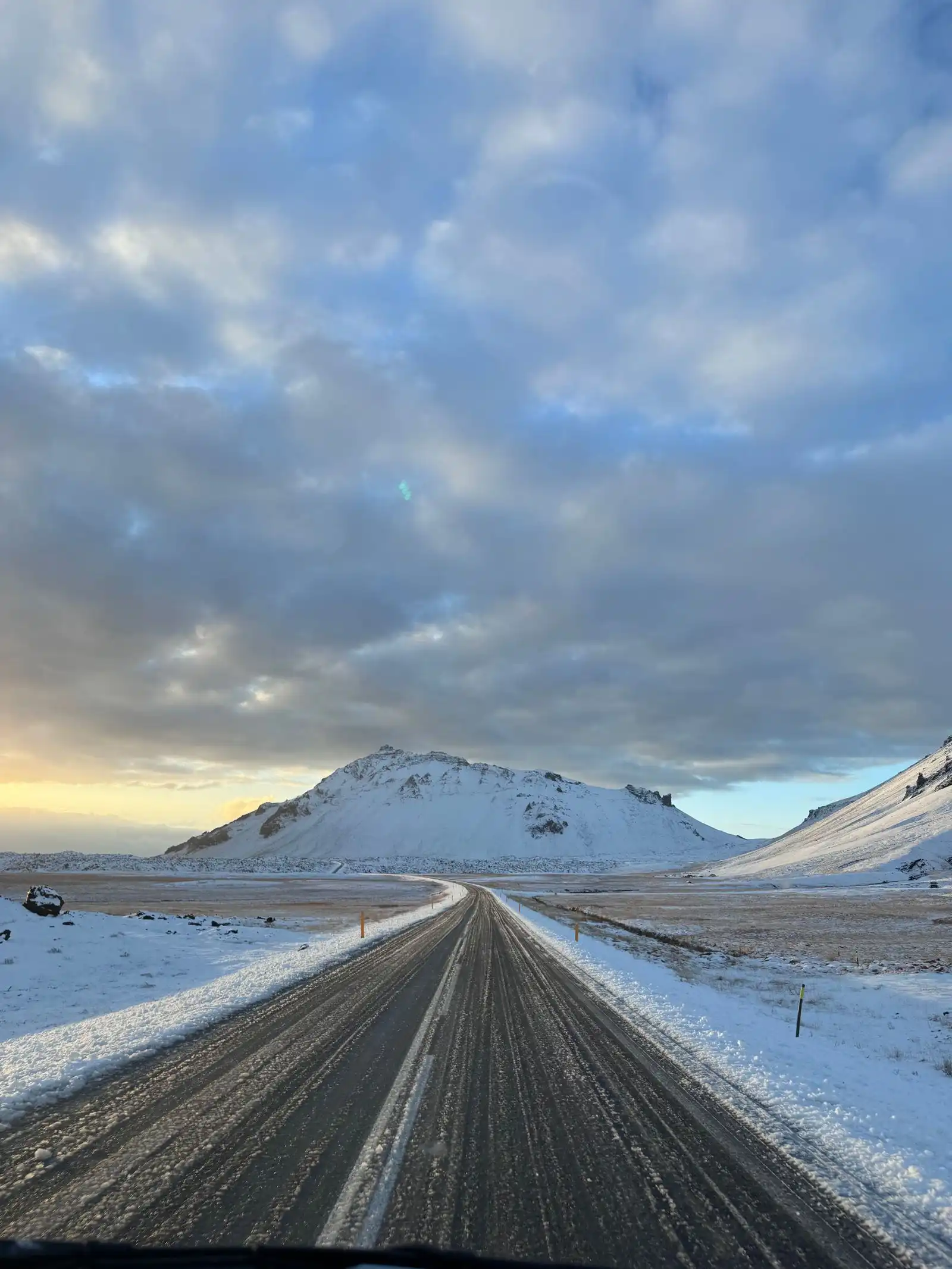 Road through snow-covered mountains in Iceland
