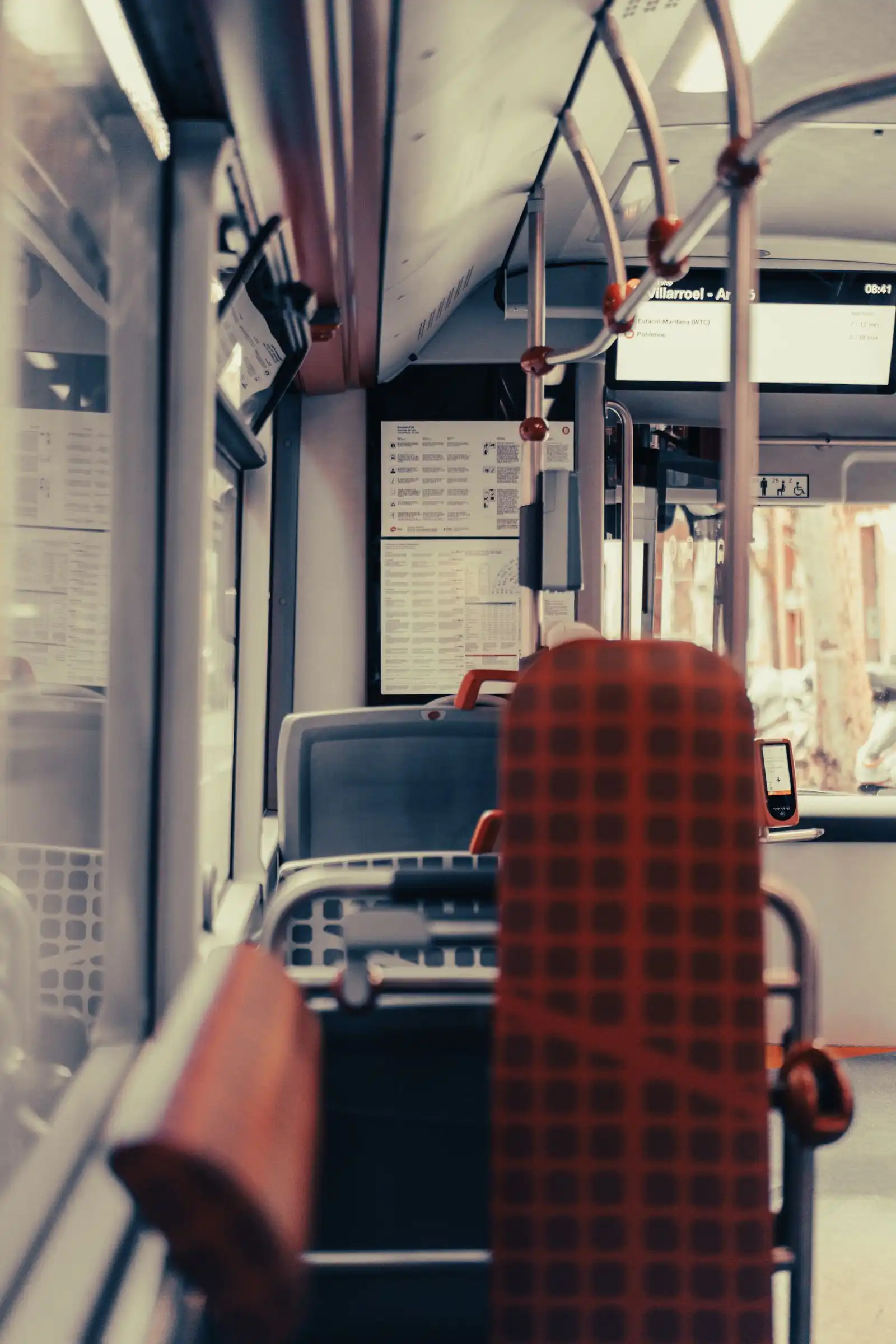 Seats and handrails inside a city bus