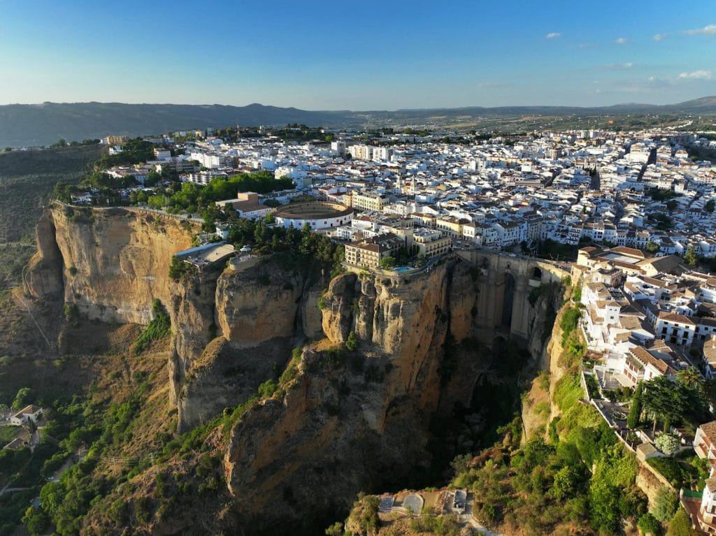 Explore the breathtaking aerial view of Ronda, Spain, with its dramatic cliffs and historic architecture.