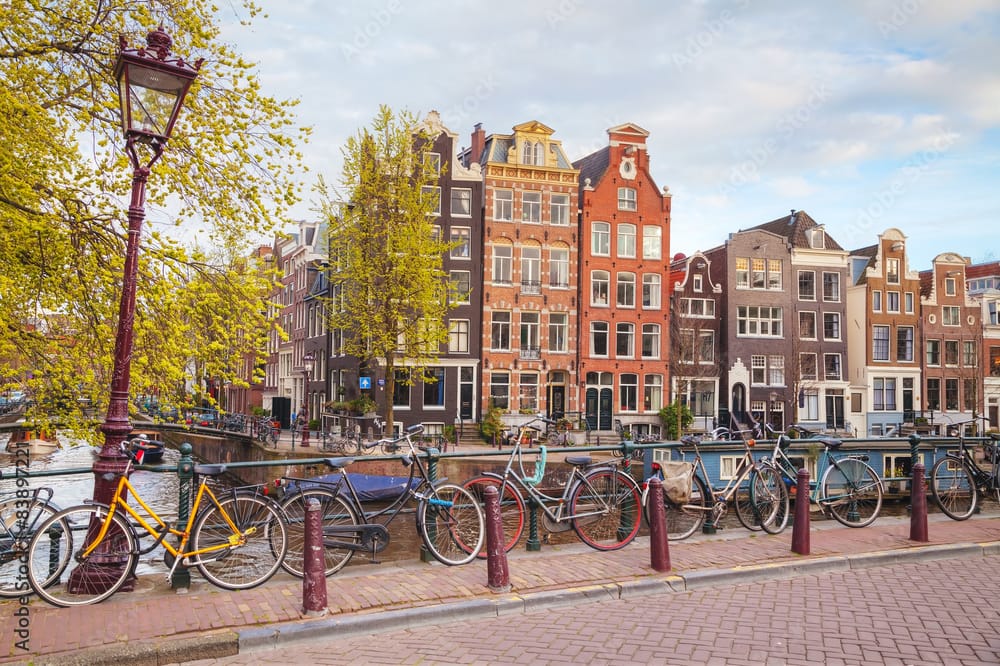 Bicycles parked on a bridge in Amsterdam