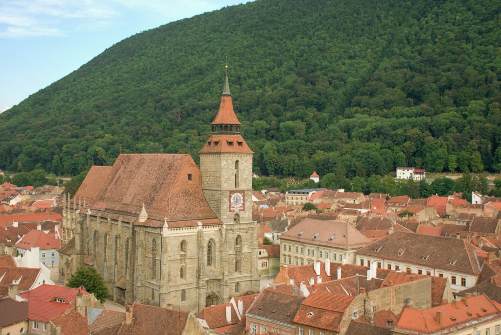 A view of a city with a mountain in the background